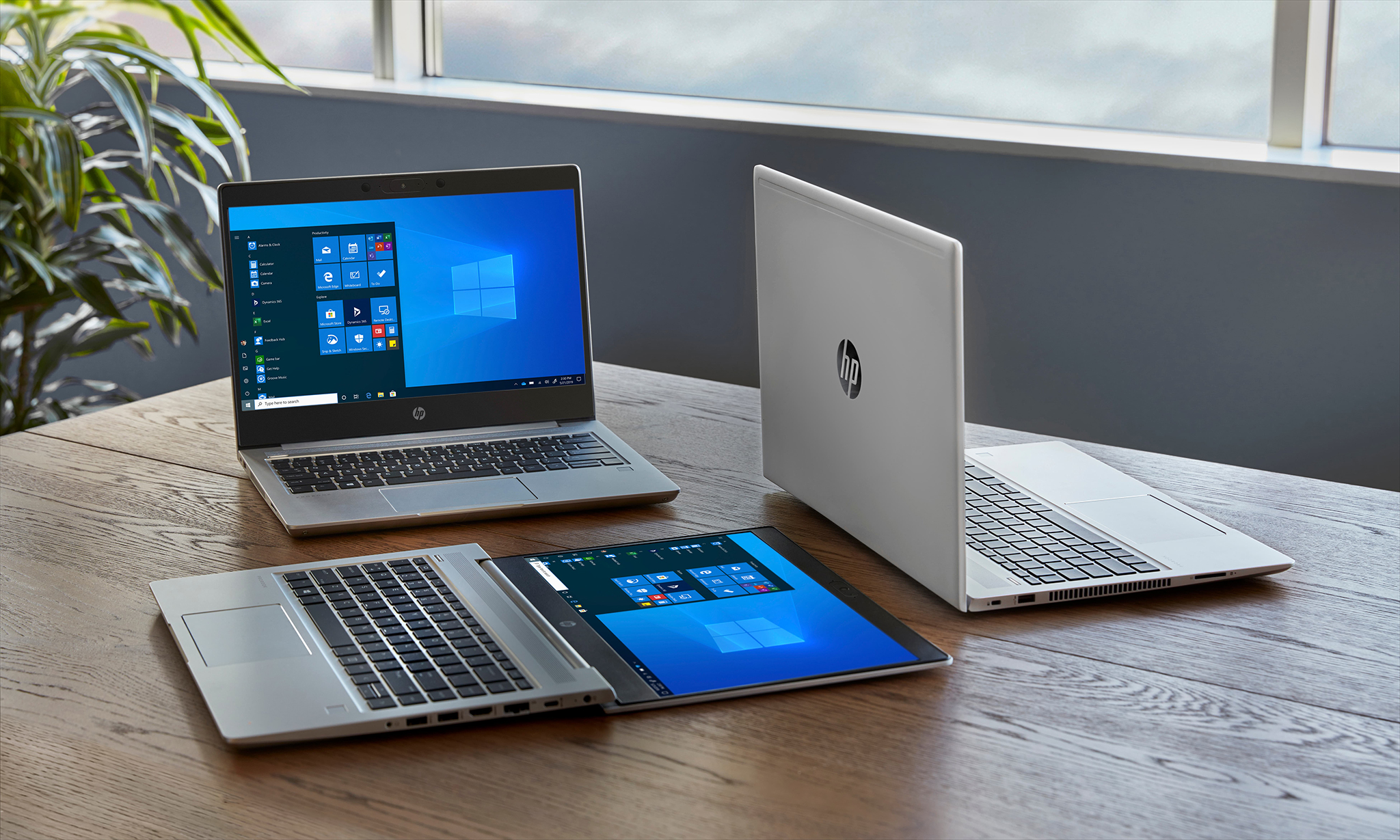 hp laptops on wood office table imaging services