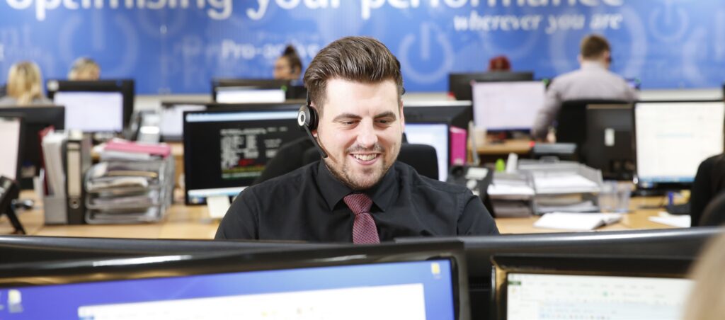 apogee employee man at computer technical support call