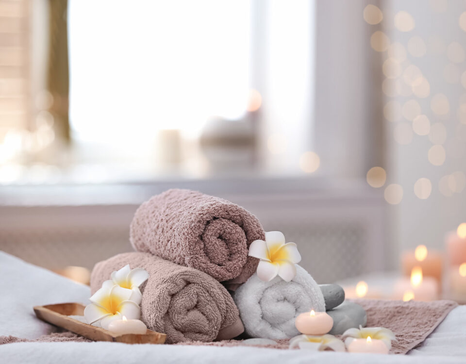 hotel spa rolled towels soaps candles luxury