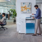 HP 6828 Enterprise office photocopier scanner printer office man and woman
