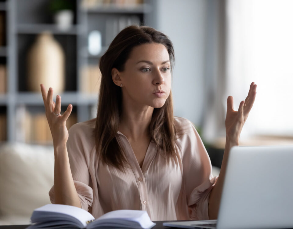 frustrated woman sitting at laptop poor productivity lack reliable tech