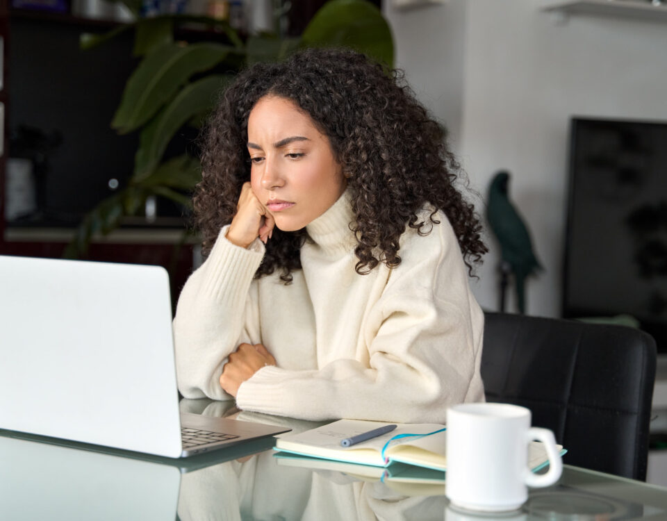 hybrid work location woman looking frustrated in home office