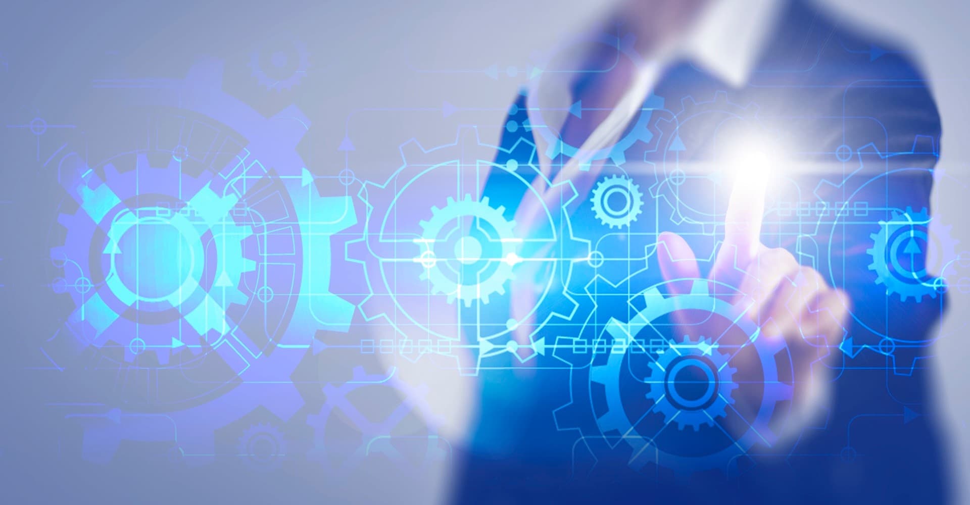 Suited businessperson manipulates technology