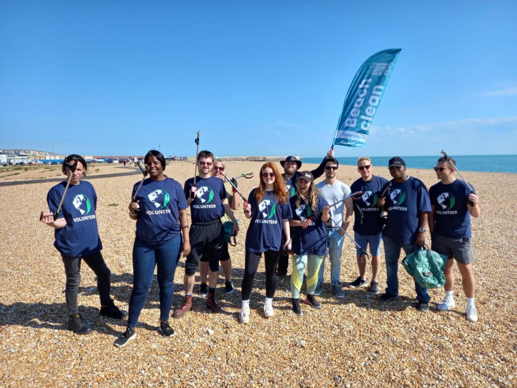 Group photo of Apogee volunteers in Folkestone for Great British Beach Clean 2023
