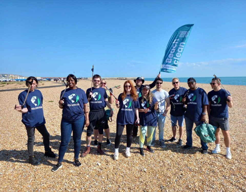 Group photo of Apogee volunteers in Folkestone for Great British Beach Clean 2023