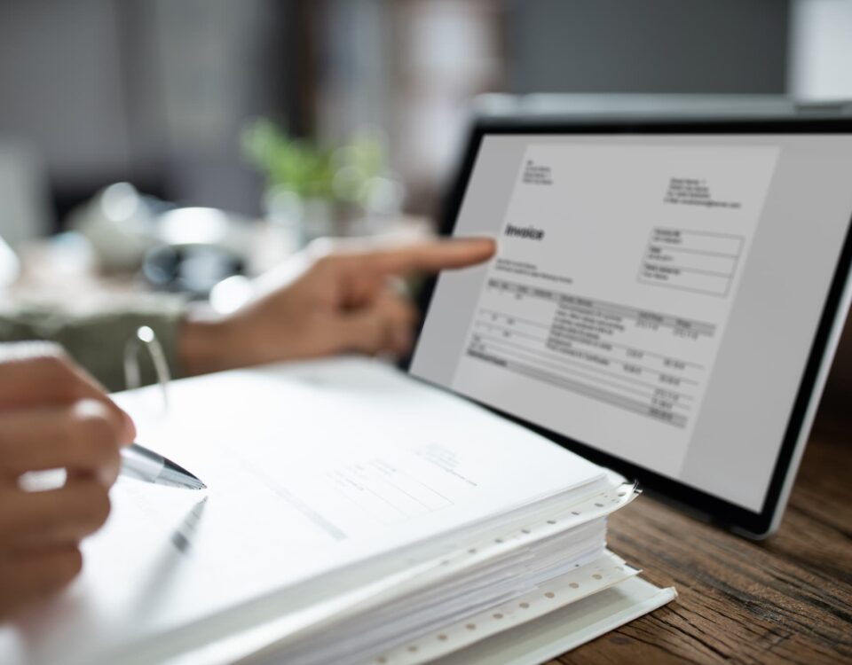 employee with tablet digitising physical documents