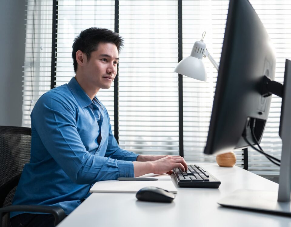 employee works on desktop computer