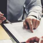 legal documents signing pen at desk