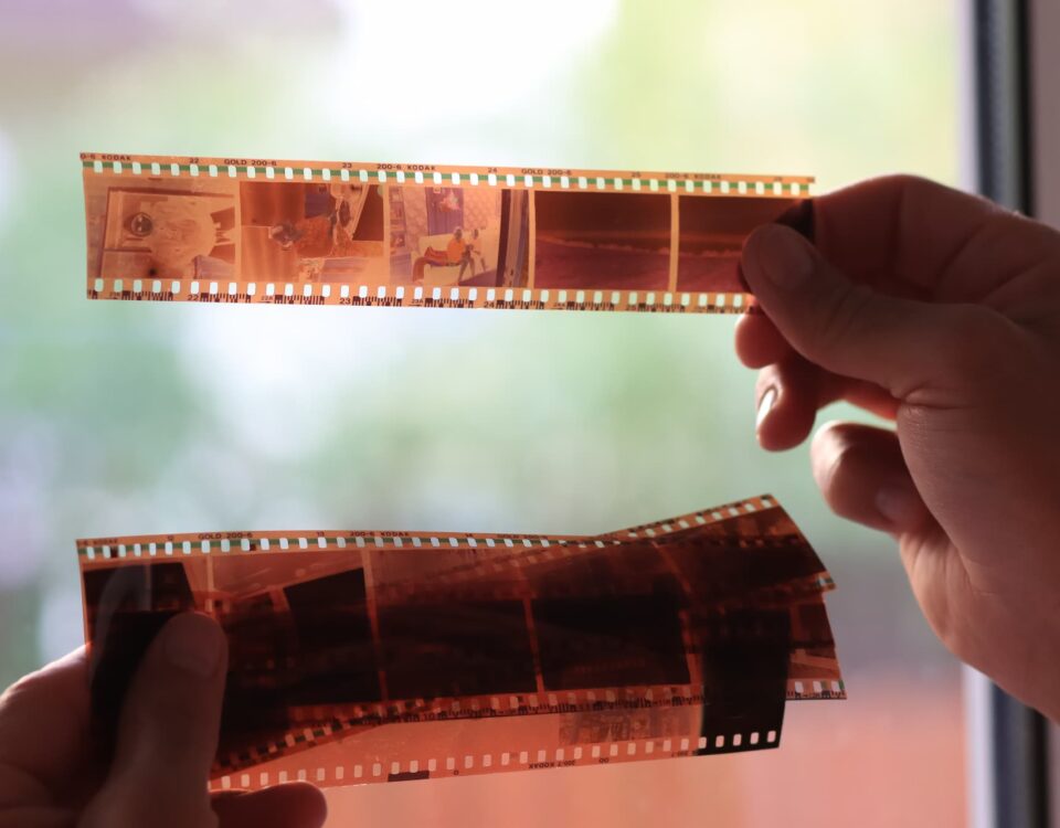 anaolog photography on filmstrip hands holding microfilm