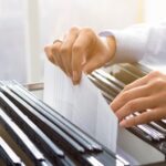 office clerk searching files in the filing cabinet