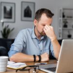 entrepreneur in home office frustrated