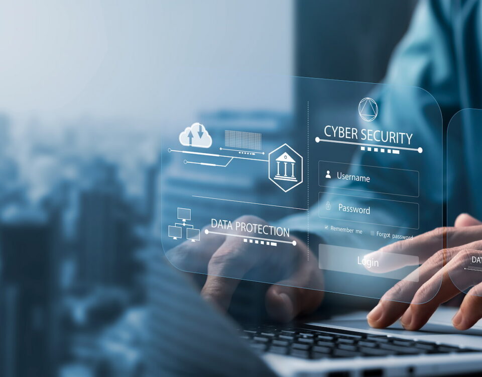 typing on a keyboard with business cyber security network graphic overlay