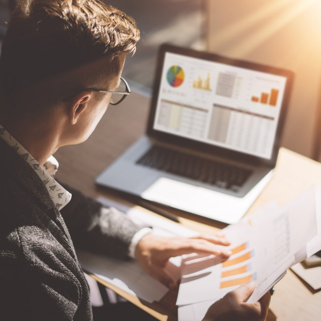 Production Print magnifying glass over photos